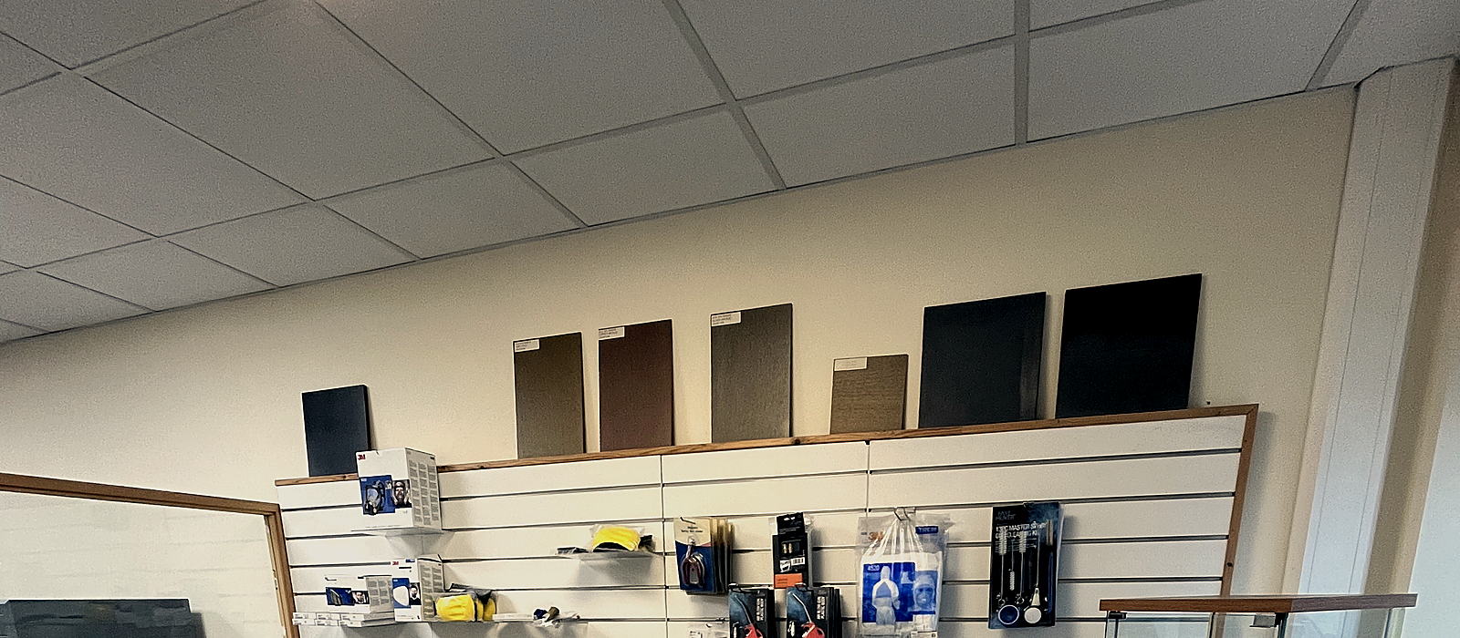 Trade counter in Tullamore with wood stain samples, spray equipment and sundries