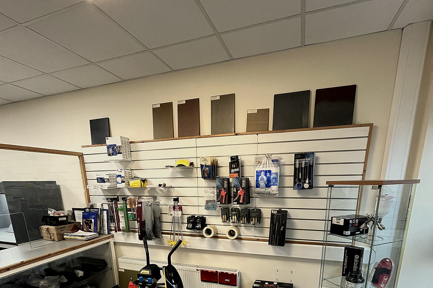Trade counter in Tullamore with wood stain samples, spray equipment and sundries